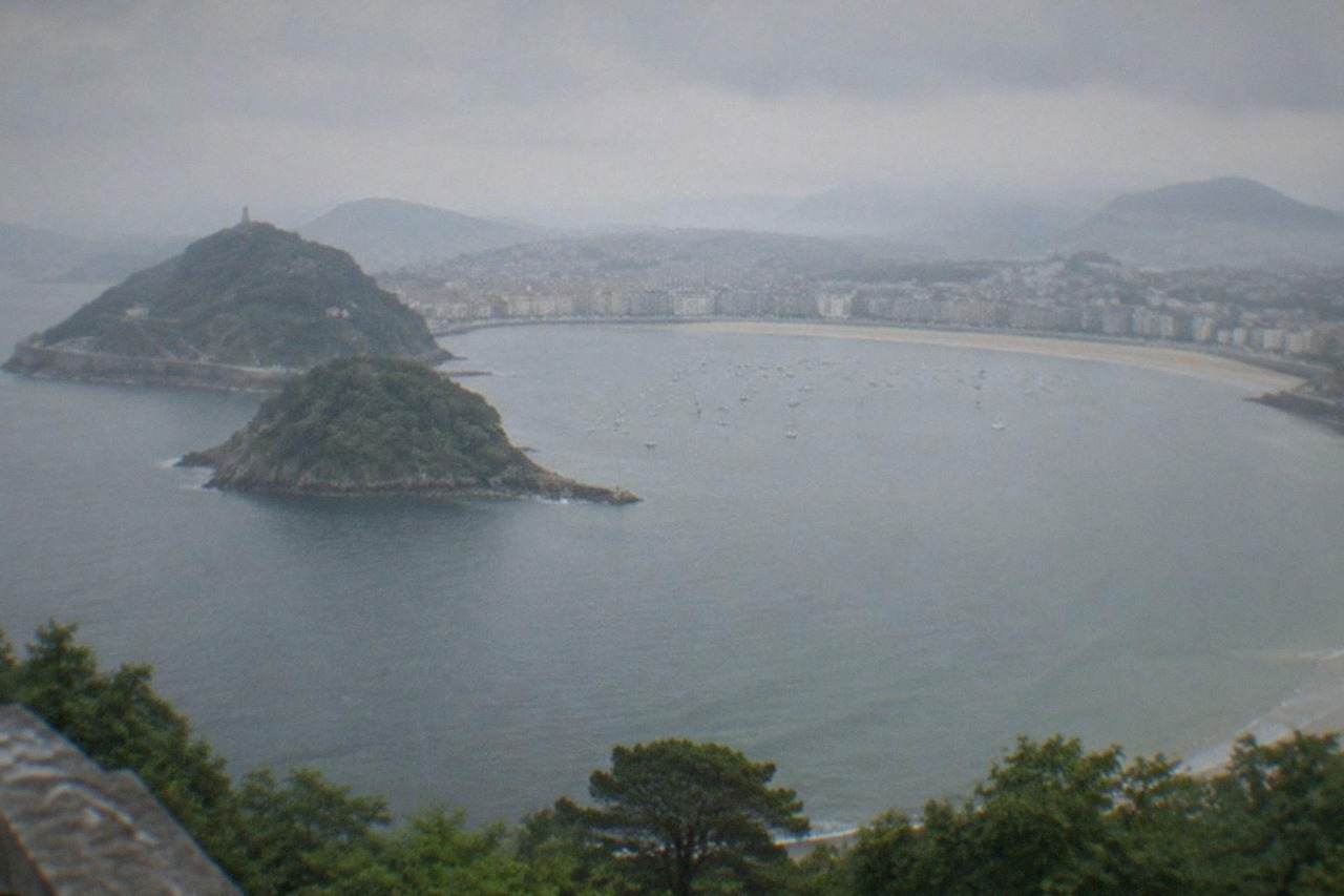 La Concha bay in San Sebastián seen from above, with the beach curving between two hills