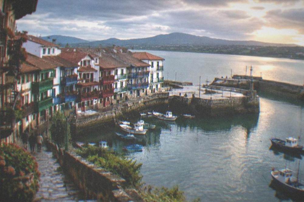 The walled old port of Hondarribia with coloured fishermen's houses at dusk