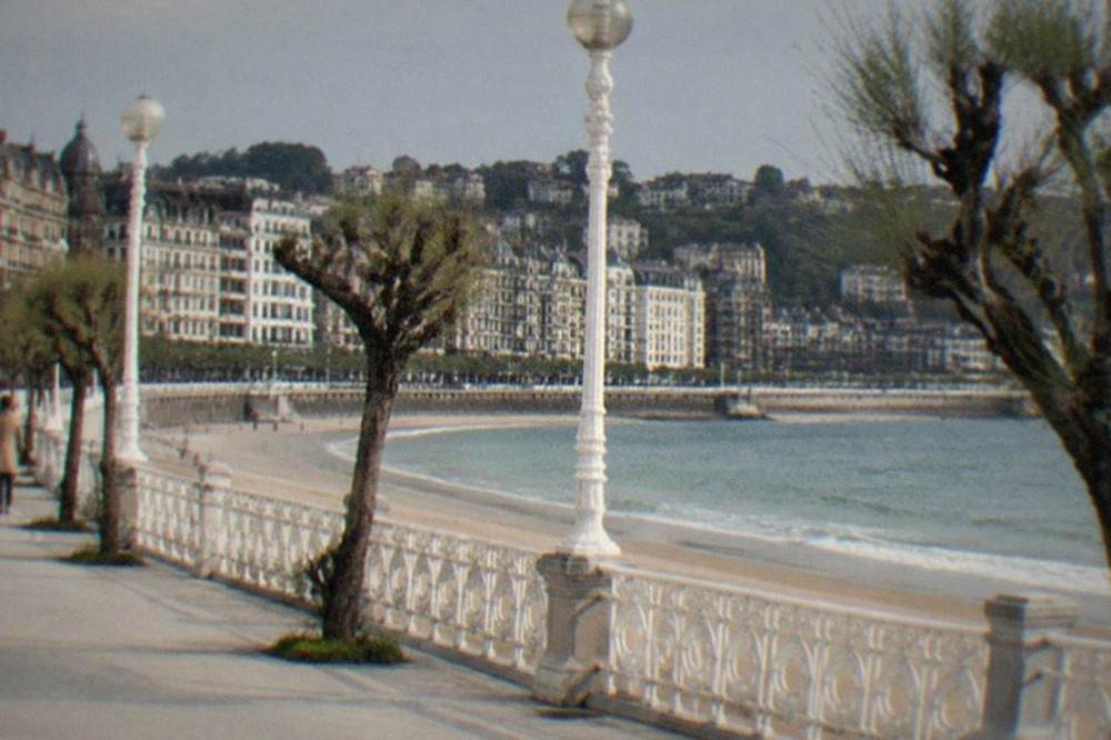 White iron railings and lamp posts along the La Concha promenade in San Sebastián