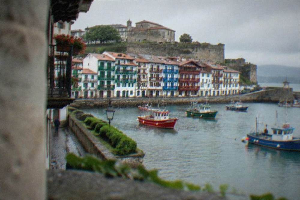 Colourful fishing boats and waterfront houses in the old port of Hondarribia near San Sebastián