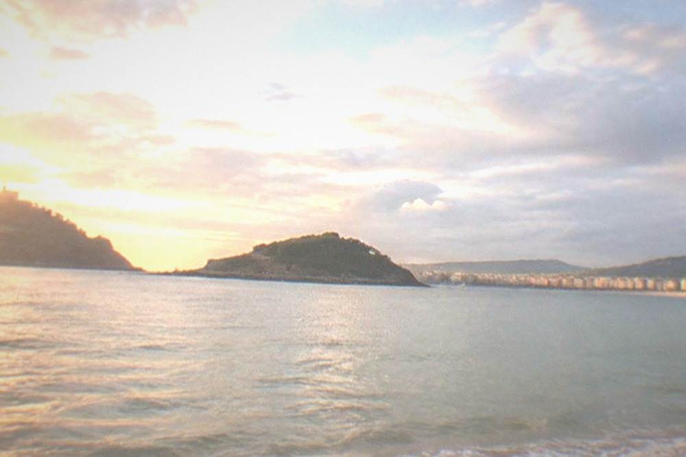Clouds and sunshine over La Concha bay in San Sebastián