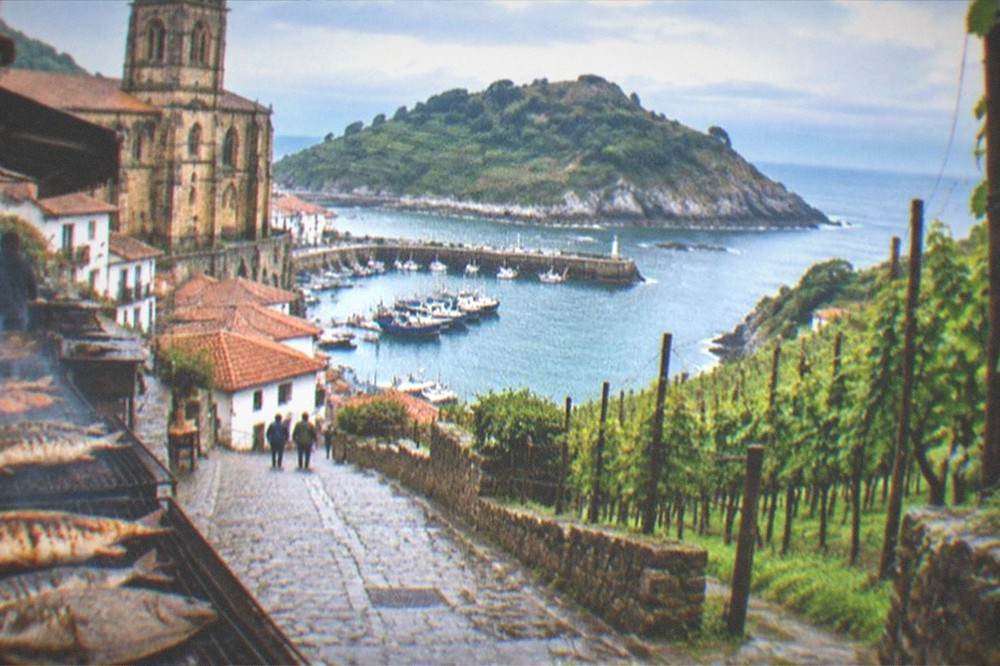 The Basque coastline seen from a hillside path with the sea beyond